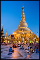 Praying from the Victory Ground, Shwedagon Pagoda, dusk. Yangon, Myanmar