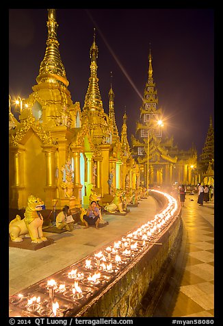 Oil lamps, stupas and shrines at night, Shwedagon Pagoda. Yangon, Myanmar