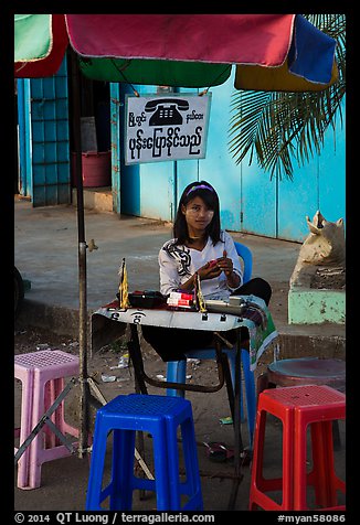 Phone booth operator. Yangon, Myanmar (color)
