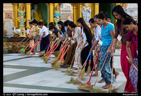 Women lining up to sweep the platform, Shwedagon Pagoda. Yangon, Myanmar (color)