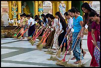 Women lining up to sweep the platform, Shwedagon Pagoda. Yangon, Myanmar ( color)