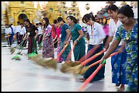 Row of women sweeping, Shwedagon Pagoda. Yangon, Myanmar