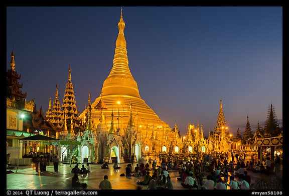 Praying from the Victory Ground, Shwedagon Pagoda, dusk. Yangon, Myanmar