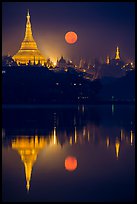 Full Moon setting over Shwedagon Pagoda and Kandawgyi Lake. Yangon, Myanmar ( color)