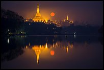 Moonset over Shwedagon Pagoda and Kandawgyi Lake. Yangon, Myanmar