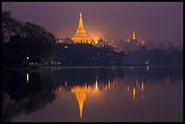 Shwedagon Pagoda reflected in Royal (Kandawgyi) Lake at twilight. Yangon, Myanmar ( color)