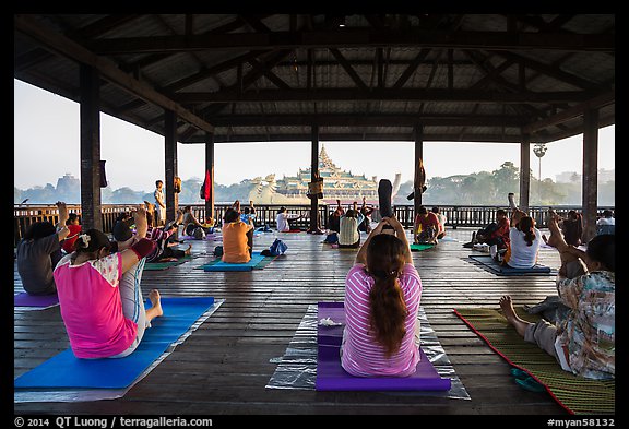 Women exercising in pavillion on Kandawgyi lake near Karawiek Hall. Yangon, Myanmar (color)