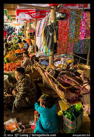 Infant sleeping in cradle in Nyaung U market. Bagan, Myanmar (color)