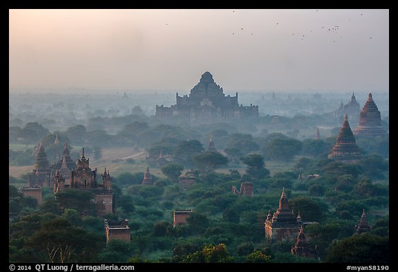 Aerial view of ancient temples in sunrise mist. Bagan, Myanmar (color)