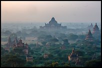 Aerial view of ancient temples in sunrise mist. Bagan, Myanmar ( color)