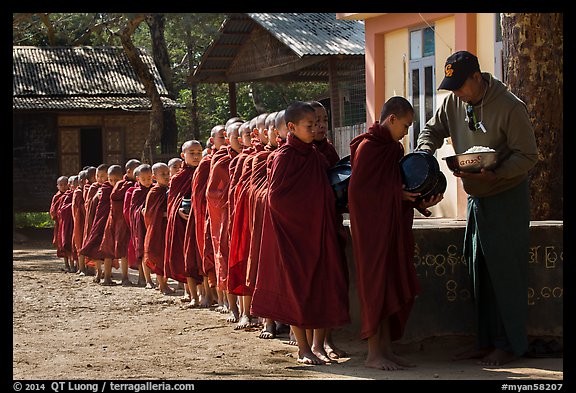 Buddhist novices lining up to receive rice for lunch, Nyaung U. Bagan, Myanmar (color)