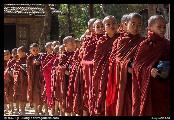 Novices lining up with alms bowls, Nyaung U. Bagan, Myanmar (color)