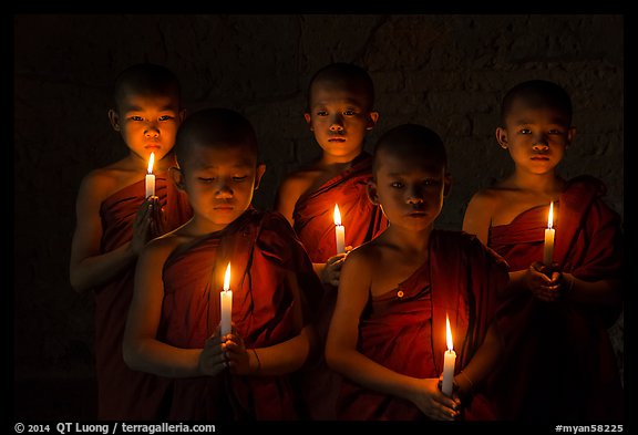 Young buddhist novices holding candles. Bagan, Myanmar (color)