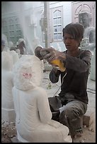 Man carving marble buddha statue with grinder. Mandalay, Myanmar ( color)
