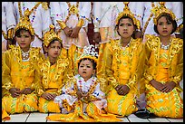 Girls and boy dressed in glittering clothes and make-up to look like princes, Novitiation, Mahamuni Pagoda. Mandalay, Myanmar ( color)