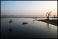 Tree skeletons and boats, Taungthaman Lake. Amarapura, Myanmar ( color)