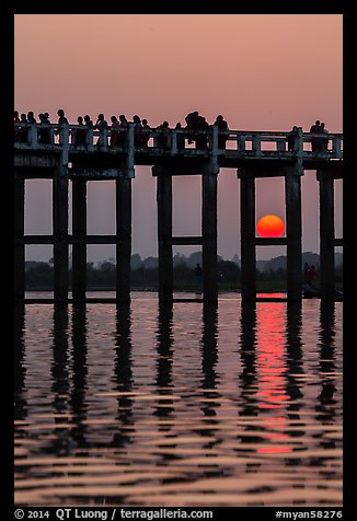 Sun setting behind U Bein Bridge. Amarapura, Myanmar (color)
