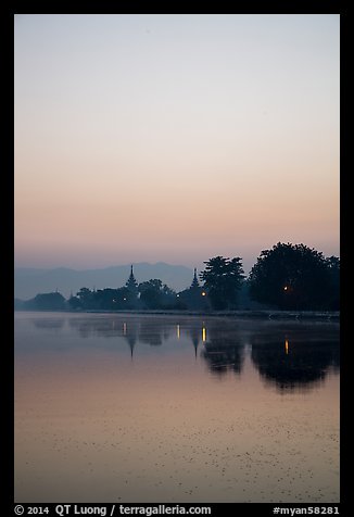 Pastel colors of dawn on Mandalay Fort moat. Mandalay, Myanmar (color)