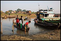 Passengers disembark from boat after short crossing. Mandalay, Myanmar ( color)