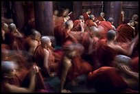 Monks in motion during prayer. Mandalay, Myanmar ( color)