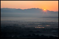 Sun rising over Shan Yoma mountains. Mandalay, Myanmar ( color)