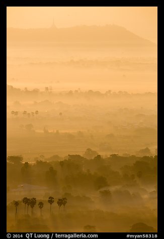 Ridges in mist at sunrise seen from Mandalay Hill. Mandalay, Myanmar (color)