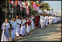 Children carry Buddhist flags ahead of alms procession. Mandalay, Myanmar ( color)