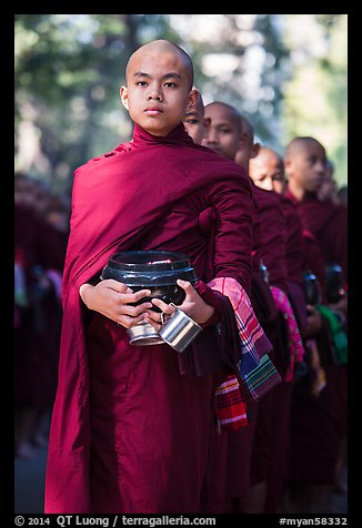 Monks stand in line before lunch, Mahagandayon Monastery. Amarapura, Myanmar (color)