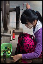 Woman assembling a yarn package. Amarapura, Myanmar ( color)