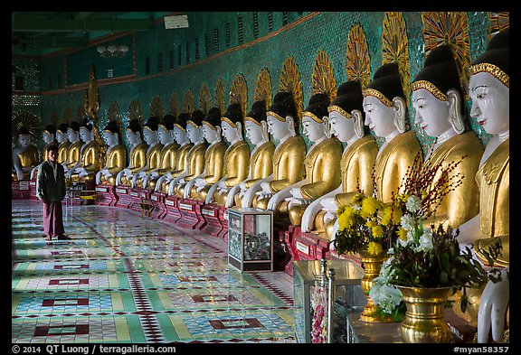 Buddha images in crescent-shaped hall, U Min Thonze pagoda, Sagaing. Myanmar (color)