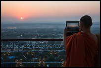 Monk taking picture of sunset from Sagaing Hill. Myanmar ( color)