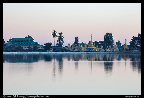 Pagoda reflected in Pone Tanoke Lake at dawn. Pindaya, Myanmar (color)