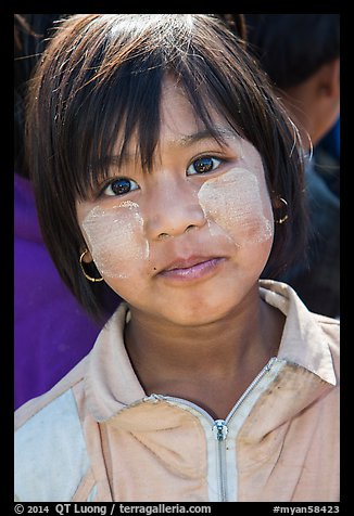 Schoolgirl with thanaka past, Nyaung Shwe. Inle Lake, Myanmar (color)