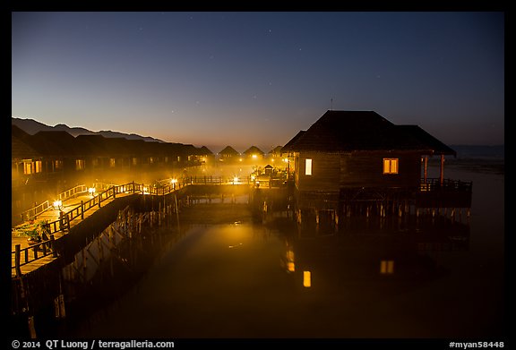 Cottages on stilts at dawn, Myanmar Treasure Resort. Inle Lake, Myanmar (color)