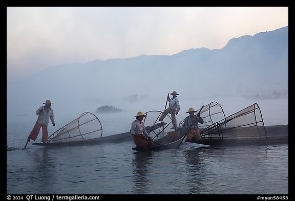 Intha fishermen gathering in dawn mist. Inle Lake, Myanmar (color)