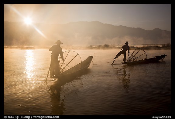 Sun piercing mist behind Intha fishermen. Inle Lake, Myanmar (color)