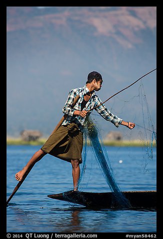 Intha fisherman gathering net. Inle Lake, Myanmar (color)