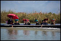 Women with turbans on long tail boat. Inle Lake, Myanmar ( color)