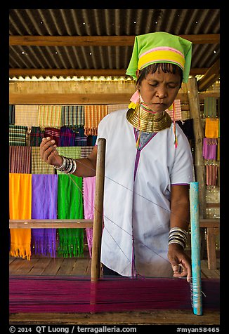 Padaung (long neck) woman threading yarn. Inle Lake, Myanmar (color)