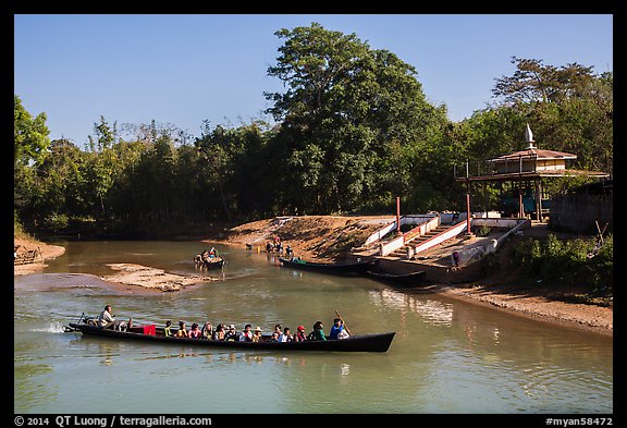 Villagers navigating canal in narrow boat, Indein. Inle Lake, Myanmar (color)