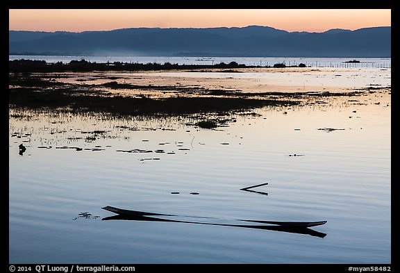 Sunken canoe at sunset. Inle Lake, Myanmar (color)