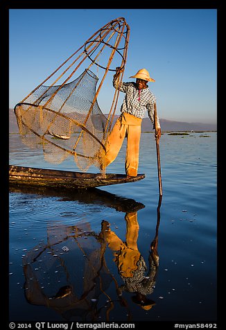 Intha fisherman with freshly caught fish in basket. Inle Lake, Myanmar (color)