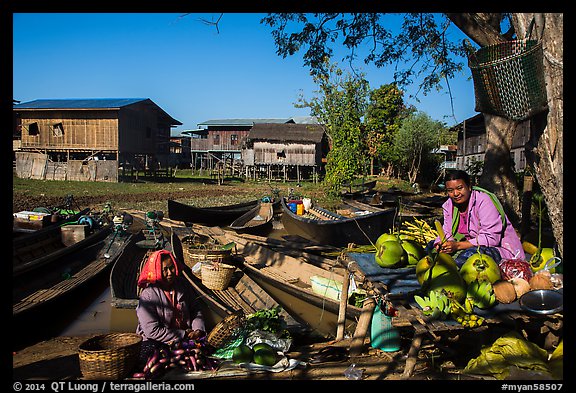 Market, boats, and village houses on stilts. Inle Lake, Myanmar (color)