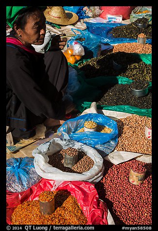 Market vendor with cheerot cigar. Inle Lake, Myanmar (color)