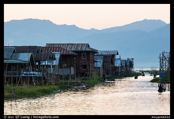 Houses and canal at sunset, Maing Thauk Village. Inle Lake, Myanmar (color)