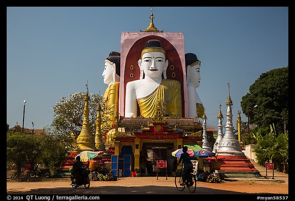 Four buddhas sitting back to back to four directions, Kyaik Pun Pagoda. Bago, Myanmar (color)