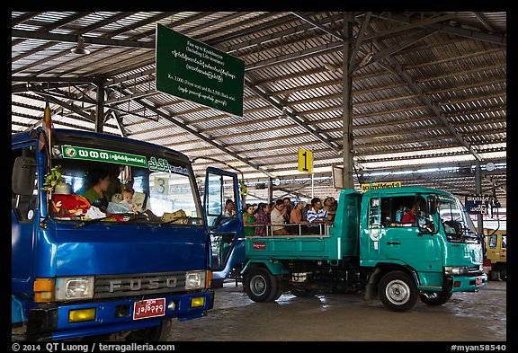 Busses and sign at base station. Kyaiktiyo, Myanmar (color)