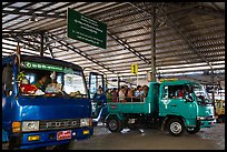 Busses and sign at base station. Kyaiktiyo, Myanmar ( color)