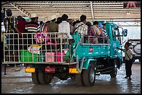 Bus leaving base station with 35 passengers in the back. Kyaiktiyo, Myanmar ( color)