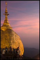 Sunset colors the sky above the Golden Rock. Kyaiktiyo, Myanmar ( color)
